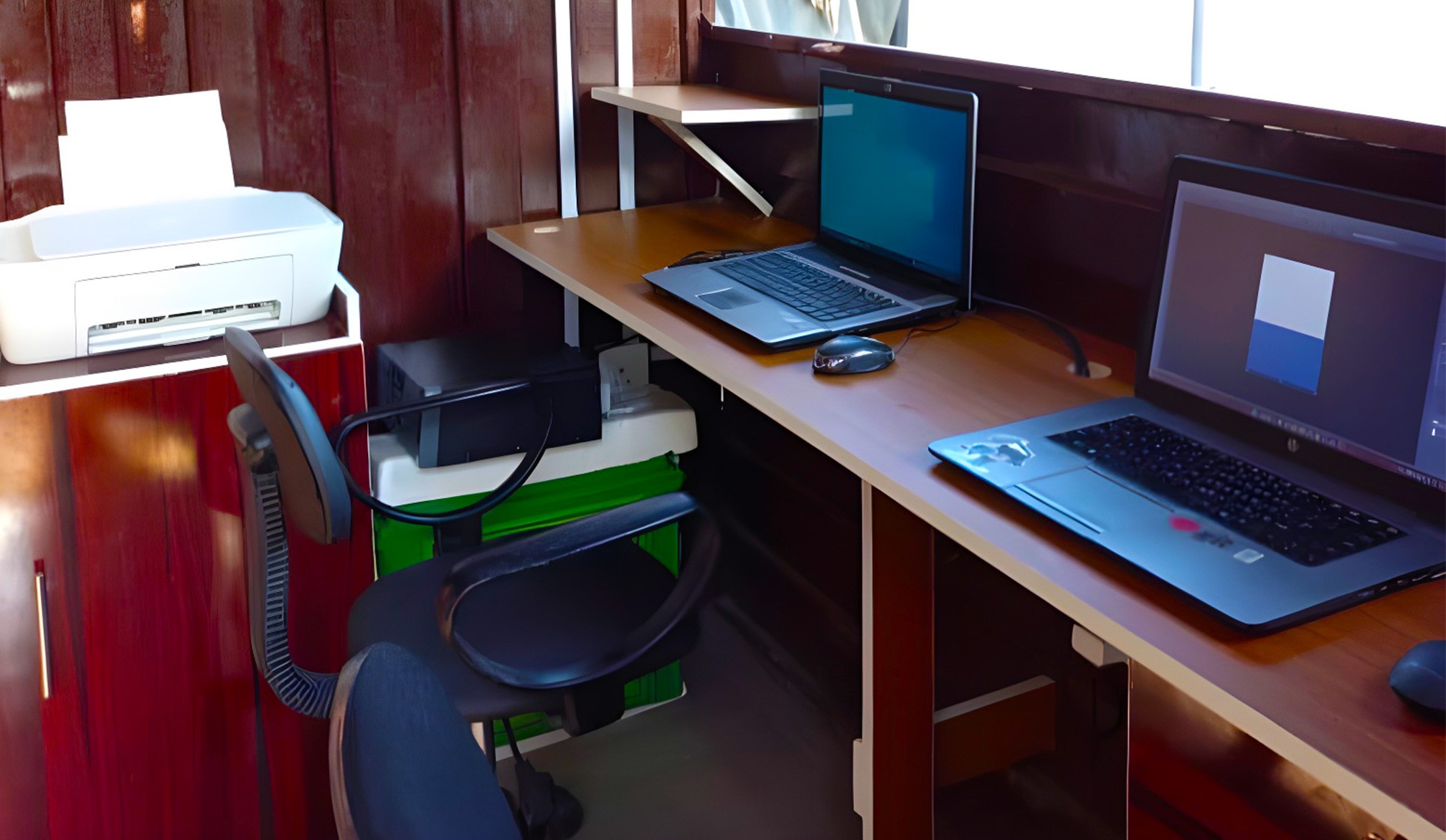 image of a printer and laptops